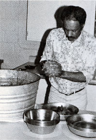 Norman Fraiser, manager of Seaward Kennels, preparing a special blend of foods.